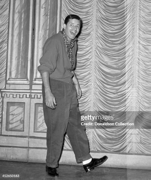 Comedian Jerry Lewis poses for a portrait backstage at the Jerry Lewis Variety Show at the RKO Palace Theater on Broadway on February 7, 1957 in New...