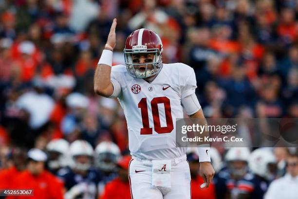 McCarron celebrates a second quarter touchdown by Jalston Fowler of the Alabama Crimson Tide against the Auburn Tigers at Jordan-Hare Stadium on...