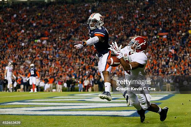 DeAndrew White of the Alabama Crimson Tide fails to complete a third quarter pass against the defense of Jermaine Whitehead of the Auburn Tigers at...