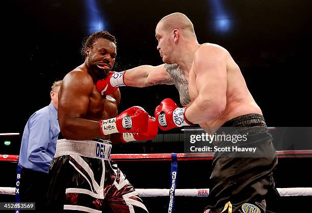 Dereck Chisora is caught by Ondrej Pala during their WBO and Vacant International Heavyweight Championship bout at The Copper Box on November 30,...