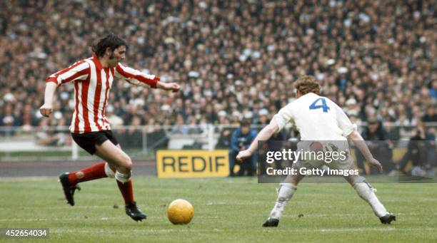 Sunderland striker Ian Porterfield runs at Billy Bremner of Leeds United during the 1973 FA Cup Final which Sunderland won with a goal from...