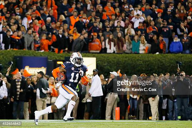 Chris Davis of the Auburn Tigers returns a missed field goal for the winning touchdown in their 34 to 28 win over the Alabama Crimson Tide at...