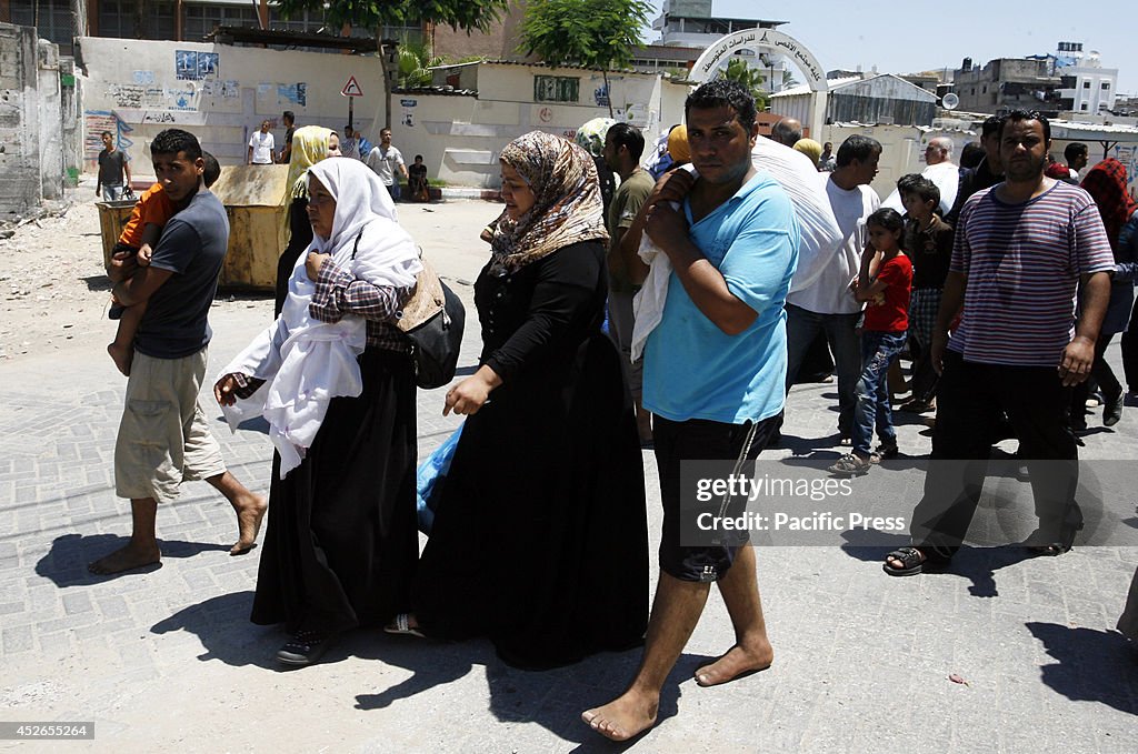 Palestinian families leave their homes to a safer location...