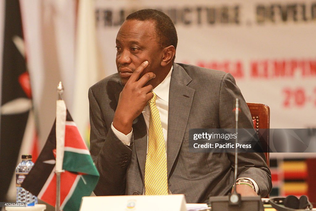 The Kenyan President Uhuru Kenyatta, follows the proceedings...