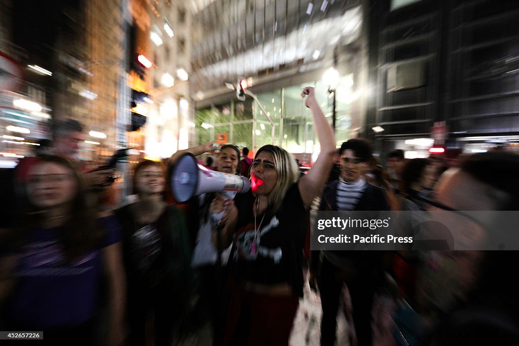 Protesters of feminist groups and other supporters make a...