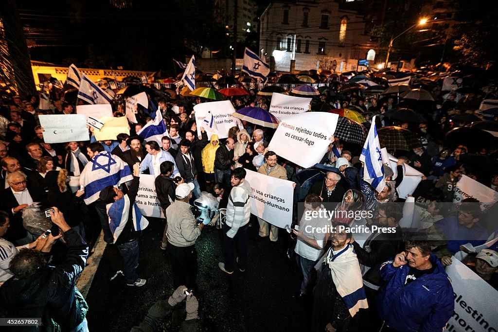 Pro-Israel Jews listen to a speech during a demonstration...