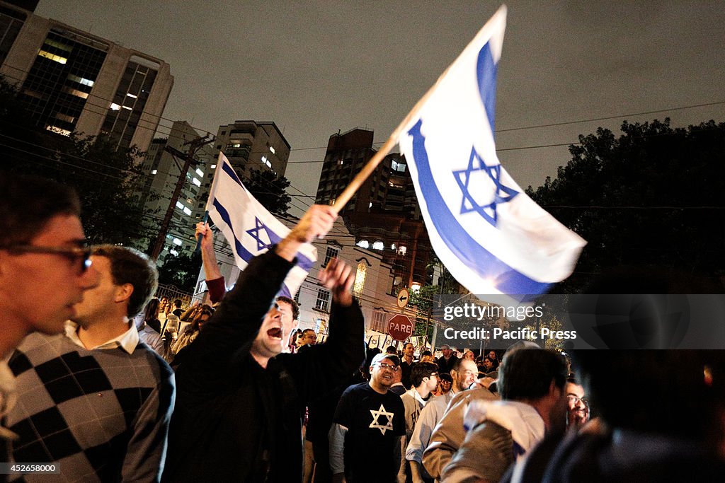 A Pro-Israel Jew waves the Israel flag during a...