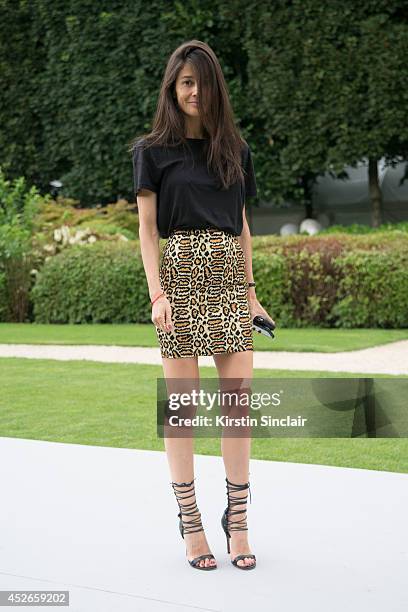 Stylist Barbara Martelo wearing Aaliyah shoes, Saint Laurent skirt and vintage top day 2 of Paris Haute Couture Fashion Week Autumn/Winter 2014, on...