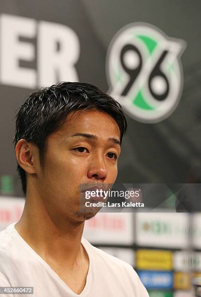 New signing Hiroshi Kiyotake is seen during a press conference at HDI Arena on July 25, 2014 in Hanover, Germany.