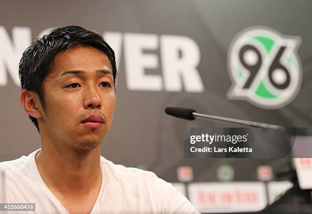 New signing Hiroshi Kiyotake is seen during a press conference at HDI Arena on July 25, 2014 in Hanover, Germany.