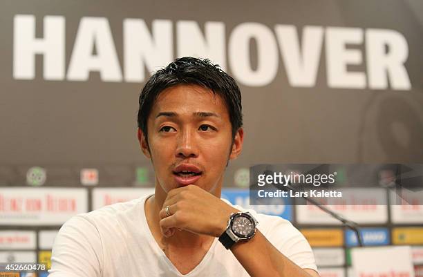 New signing Hiroshi Kiyotake is seen during a press conference at HDI Arena on July 25, 2014 in Hanover, Germany.