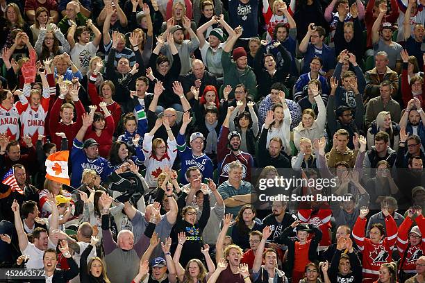 The crowd cheers during the International Ice Hockey Series match between the United States and Canada at Rod Laver Arena on July 25, 2014 in...