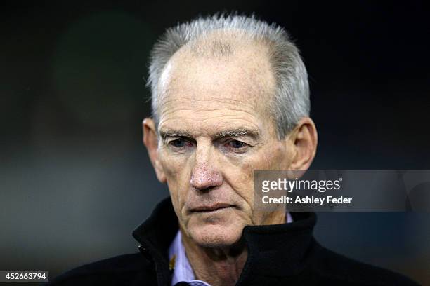 Wayne Bennett coach of the Knights looks on before the game during the round 20 NRL match between the Newcastle Knights and the Sydney Roosters at...