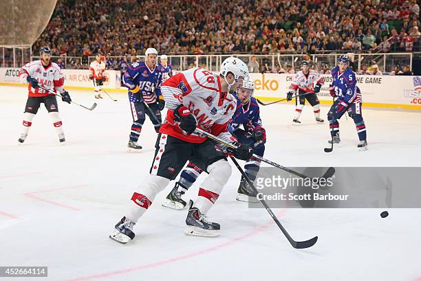 Matt Kassian of Canada competes for the puck during the International Ice Hockey Series match between the United States and Canada at Rod Laver Arena...