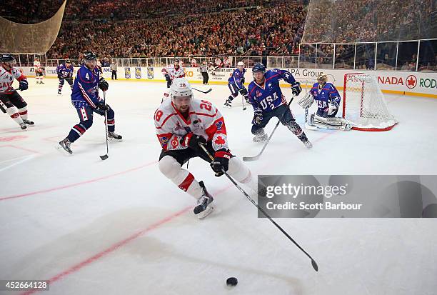 Matt Kassian of Canada competes for the puck during the International Ice Hockey Series match between the United States and Canada at Rod Laver Arena...