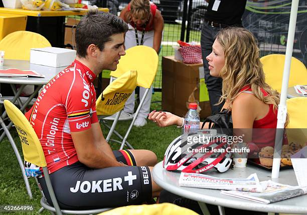 Tony Gallopin of France and Lotto-Belisol and his girlfriend, professional cyclist Marion Rousse relax prior to the start of stage eighteen of the...