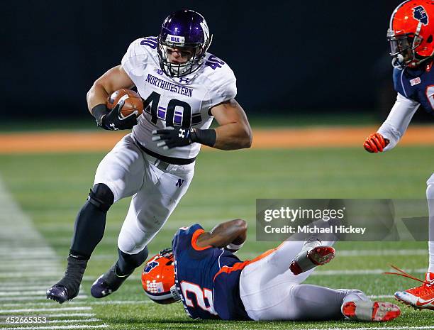 Fullback Dan Vitale of the Northwestern Wildcats runs the ball against the Illinois Fighting Illini at Memorial Stadium on November 30, 2013 in...