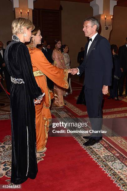 Actor Lambert Wilson is greeted by Princess Lalla Meryem of Morocco and Melita Toscan du Plantier as he attends the Royal Gala Dinner during the 13th...