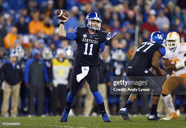 Maxwell Smith of the Kentucky Wildcats throws a pass during the game against the Tennessee Volunteers at Commonwealth Stadium on November 30, 2013 in...