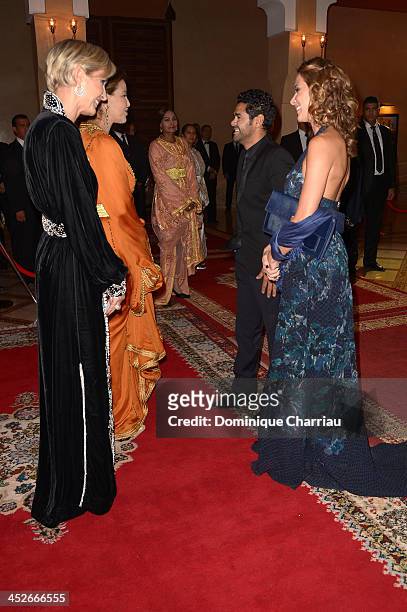 Jamel Debbouze and his wife Mélissa Theuriau are greeted by Princess Lalla Meryem of Morocco and Melita Toscan du Plantier as they attend the Royal...
