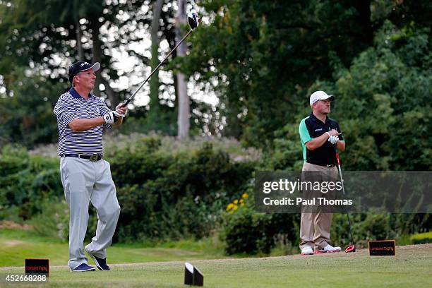 Colin Kenworthy of Dukinfield Golf Club tees off watched by team mate David Green during The Lombard Trophy North West Regional Qualifier at Dunham...