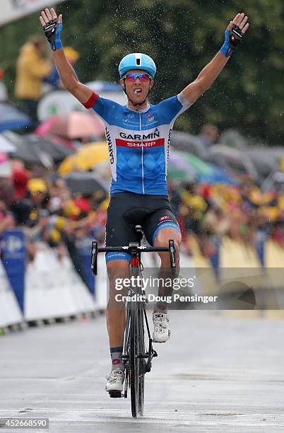 Ramunas Navardauskas of Lithuania and Garmin-Sharp celebrates as he crosses the finish line to win the nineteenth stage of the 2014 Tour de France, a...