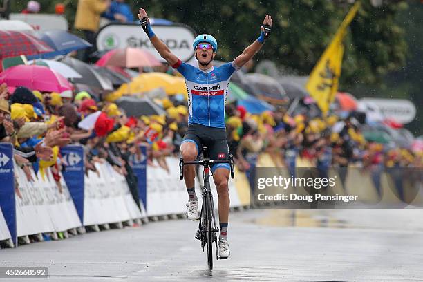 Ramunas Navardauskas of Lithuania and Garmin-Sharp celebrates as he crosses the finish line to win the nineteenth stage of the 2014 Tour de France, a...