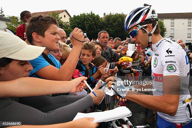 Thibaut Pinot of France and FDJ.fr signs autographs ahead of the nineteenth stage of the 2014 Tour de France, a 208km stage between Maubourguet Pays...