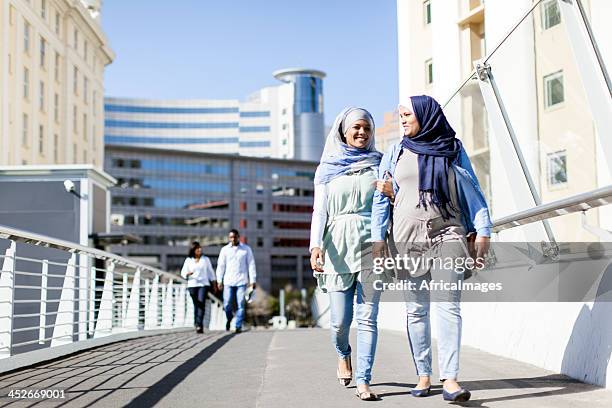 muslim friends going for a walk in cape town. - cape town cbd stock pictures, royalty-free photos & images