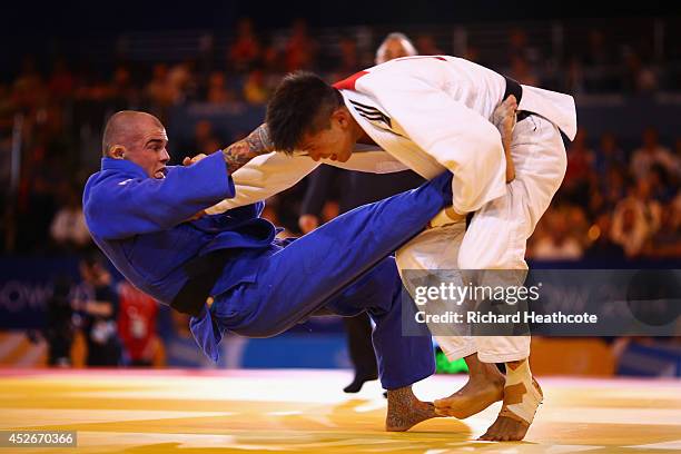 Danny Williams of England on his way to winning gold in the Men's -73kg Final - Gold Medal Contest against Adrian Leat of New Zealand at SECC...