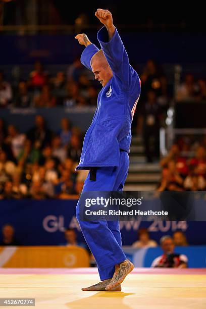Danny Williams of England celebrates winning gold in the Men's -73kg Final - Gold Medal Contest against Adrian Leat of New Zealand at SECC Precinct...