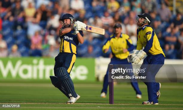 Glamorgan Dragons batsman Murray Goodwin hits the winning six as Adam Rouse looks on during the Natwest T20 Blast match between Glamorgan and...
