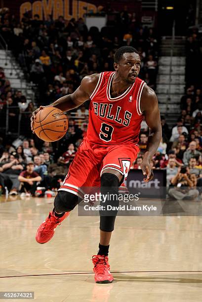 Luol Deng of the Chicago Bulls drives to the basket against the Cleveland Cavaliers at The Quicken Loans Arena on November 30, 2013 in Cleveland,...