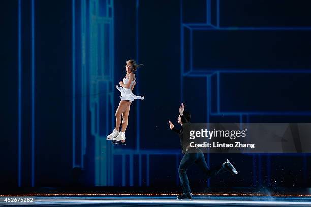 Tatiana Volosozhar and Maxim Trankov of Russia performs during the 2014 Artistry On Ice Beijing at Beijing MasterCard Center on July 25, 2014 in...