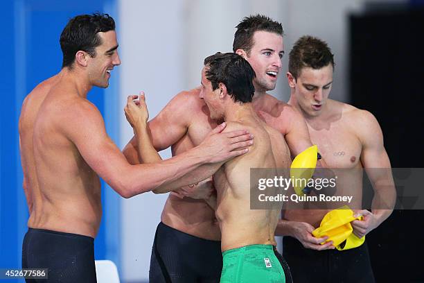 James Magnussen of Australia celebrates with team mates Cameron McEvoy, Matt Abood and Tommaso D'Orsogna after winning the gold medal in the Men's 4...