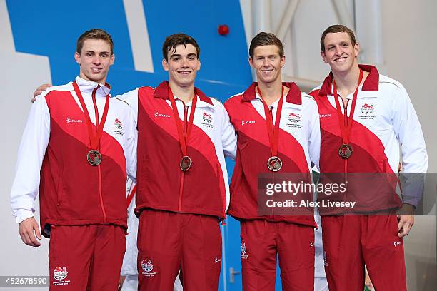 Bronze medallists Benjamin Proud, Adam Barrett, James Disney-May and Adam Brown of England pose during the medal ceremony for the Men's 4 x 100m...