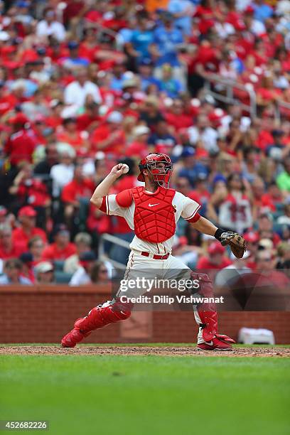 George Kottaras of the St. Louis Cardinals throws against the Los Angeles Dodgers at Busch Stadium on July 19, 2014 in St. Louis, Missouri. The...