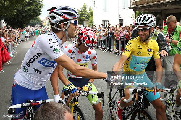 Thibaut Pinot of France and FDJ.fr shakes hands with Vincenzo Nibali of Italy and Astana Pro Team before the start of stage nineteen of the 2014 Tour...