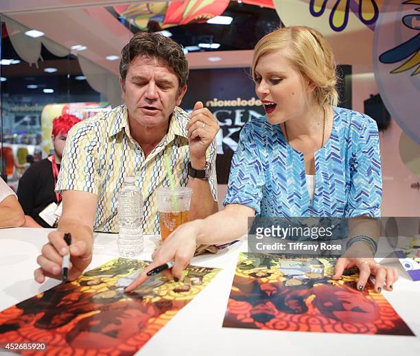 Actor John Michael Higgins and actress Janet Varney sign autographs at the Legend of Korra signing at the 2014 San Diego Comic-Con International -...