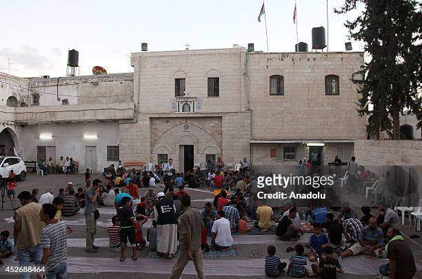Palestinian families, fleed their home due to the ongoing Israeli military operations in Gaza, take shelter at the Gaza City's Greek Orthodox church...