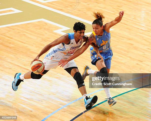 Angel McCoughtry of the Atlanta Dream drives against Courtney Clements of the Chicago Sky on July 25, 2014 at McCamish Pavilion in Atlanta, Georgia....