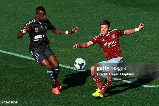 Aaron Cresswell of West Ham United clears the ball under pressure from Bernie Ibini-Isei of Sydney FC during the Football United New Zealand Tour...