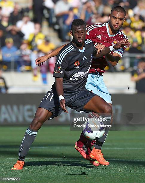 Bernie Ibini-Isei of Sydney FC looks to control the ball under pressure from Winston Reid of West Ham United during the Football United New Zealand...