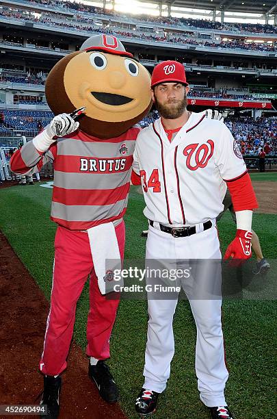 Bryce Harper of the Washington Nationals poses for a photo with the Ohio State mascot before the game against the Colorado Rockies at Nationals Park...