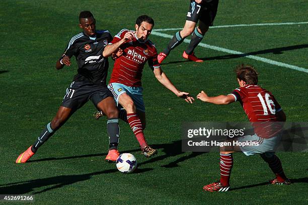 Bernie Ibini-Isei of Sydney FC and Joey O'Brien of West Ham United compete for the ball during the Football United New Zealand Tour 2014 match...