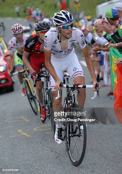 Thibaut Pinot of France and FDJ.fr in the best young rider's white jersey leads the climb to the finish during the eighteenth stage of the 2014 Tour...