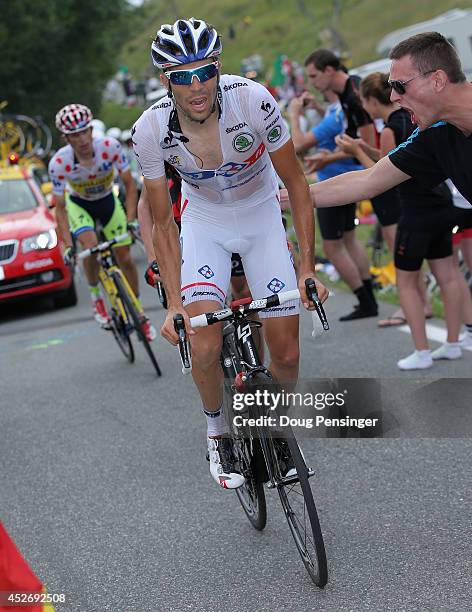 Thibaut Pinot of France and FDJ.fr in the best young rider's white jersey leads the climb to the finish during the eighteenth stage of the 2014 Tour...