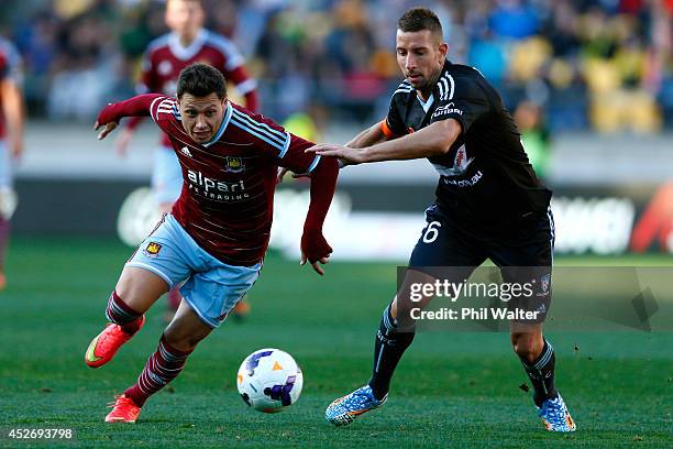 Nikola Petkovic of Sydney FC and Mauro Zarate of West Ham contest the ball during the Football United New Zealand Tour match between Sydney FC and...