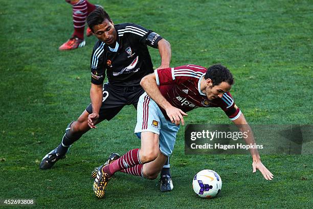 Nick Carle of Sydney FC tackles Joey O'Brien of West Ham United during the Football United New Zealand Tour 2014 match between Sydney FC and West Ham...