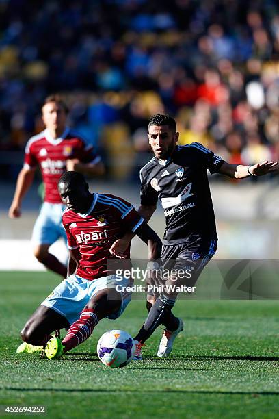 Ali Abbas of Sydney FC and Mohamed Diame of West Ham challenge for the ball during the Football United New Zealand Tour match between Sydney FC and...